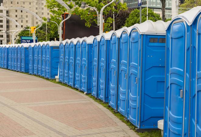 a line of portable restrooms set up for a wedding or special event, ensuring guests have access to comfortable and clean facilities throughout the duration of the celebration in Aliso Viejo